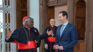 El cardenal Turkson y el presidente Assad