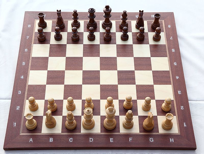 Chess_board_with_chess_set_in_opening_position_2012_PD_03