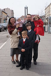 Catholic_priest_with_his_Family